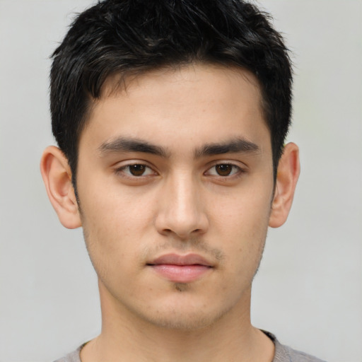 Neutral white young-adult male with short  black hair and brown eyes