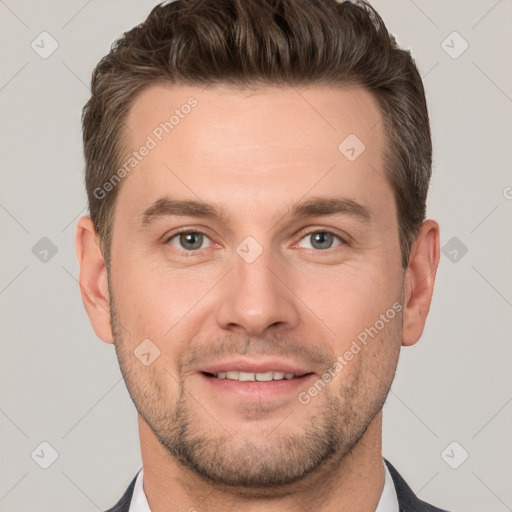 Joyful white young-adult male with short  brown hair and grey eyes