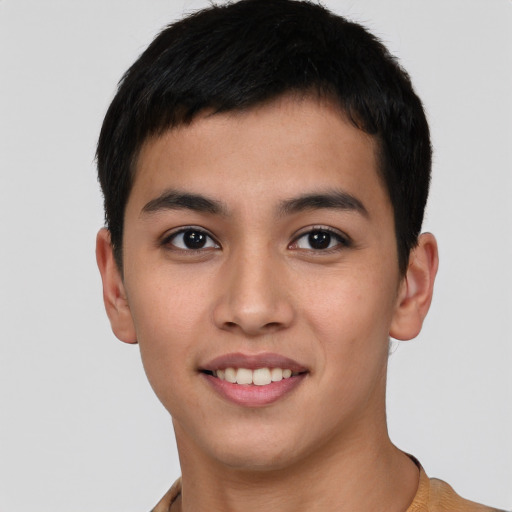 Joyful asian young-adult male with short  black hair and brown eyes