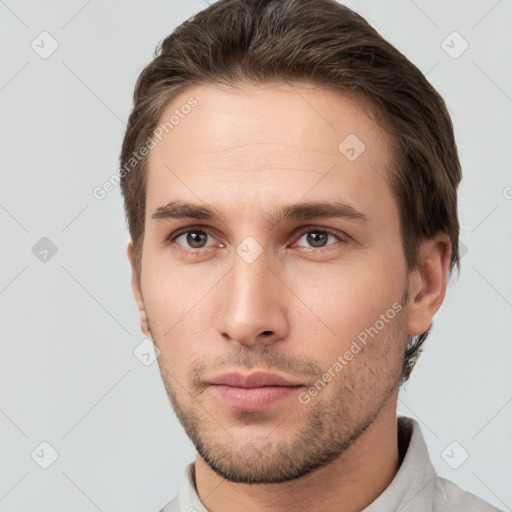 Neutral white young-adult male with short  brown hair and brown eyes