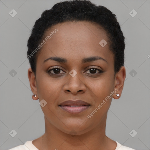 Joyful black young-adult female with short  black hair and brown eyes