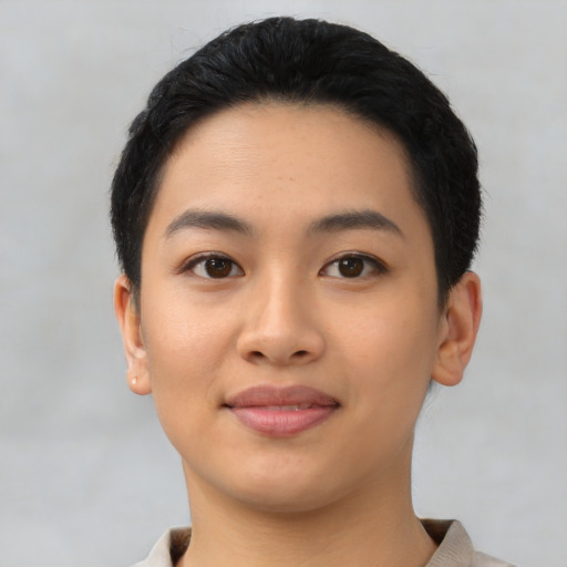 Joyful asian young-adult female with short  black hair and brown eyes