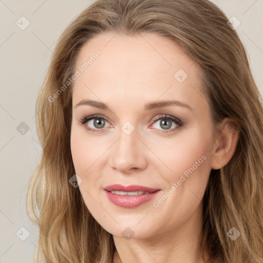 Joyful white young-adult female with long  brown hair and green eyes