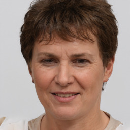 Joyful white adult female with short  brown hair and brown eyes