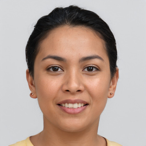 Joyful asian young-adult female with short  black hair and brown eyes