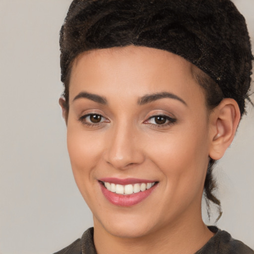 Joyful white young-adult female with short  brown hair and brown eyes