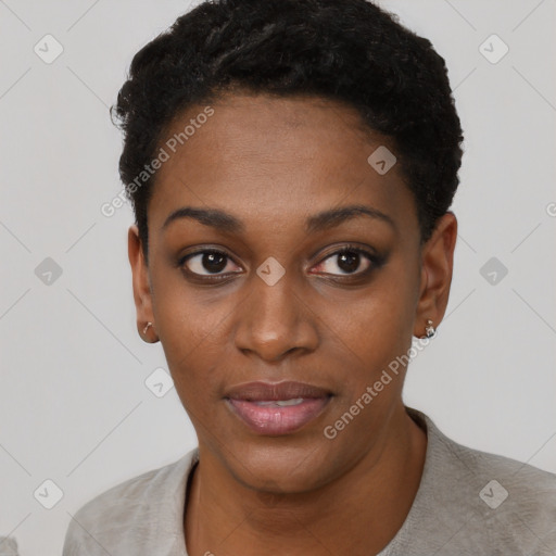 Joyful black young-adult female with short  black hair and brown eyes