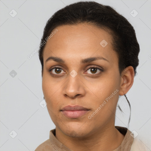 Joyful latino young-adult female with short  brown hair and brown eyes