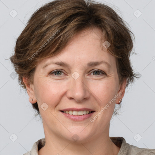 Joyful white adult female with medium  brown hair and grey eyes