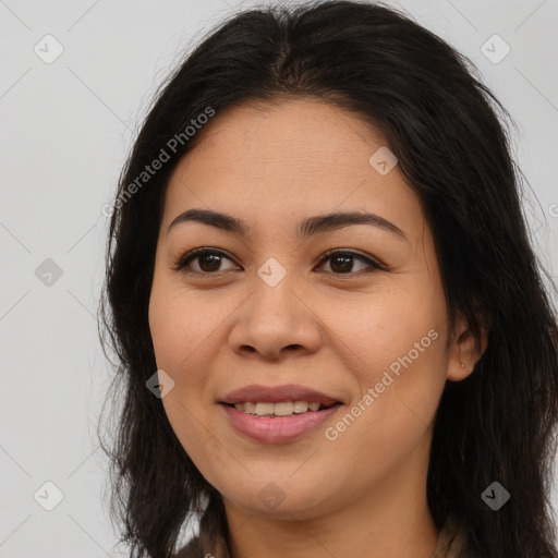 Joyful asian young-adult female with long  brown hair and brown eyes