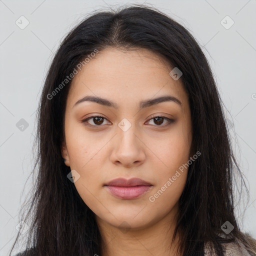 Joyful latino young-adult female with long  brown hair and brown eyes