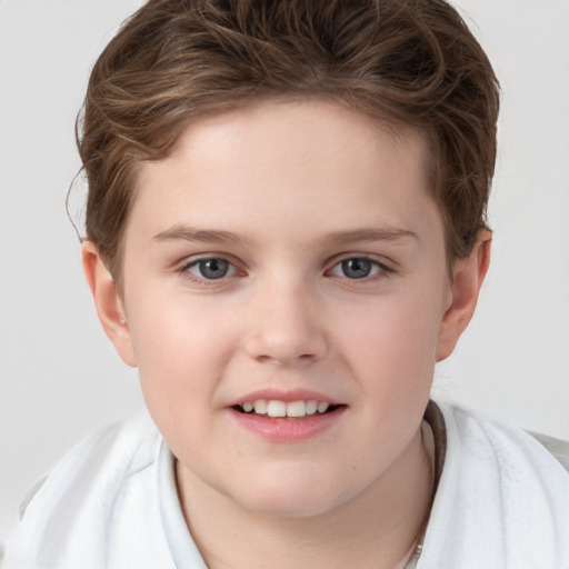 Joyful white child female with short  brown hair and grey eyes