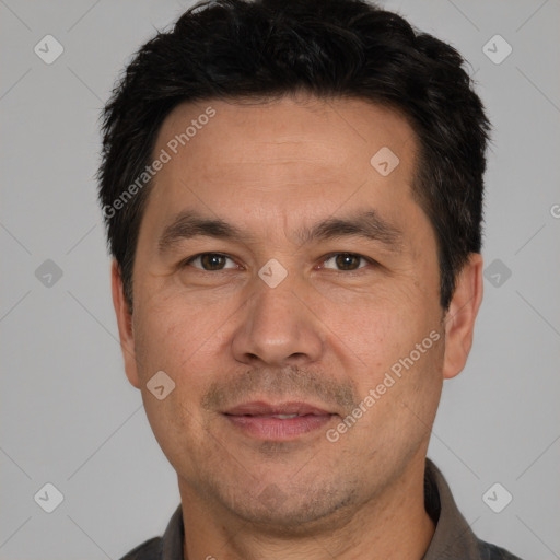 Joyful white adult male with short  black hair and brown eyes