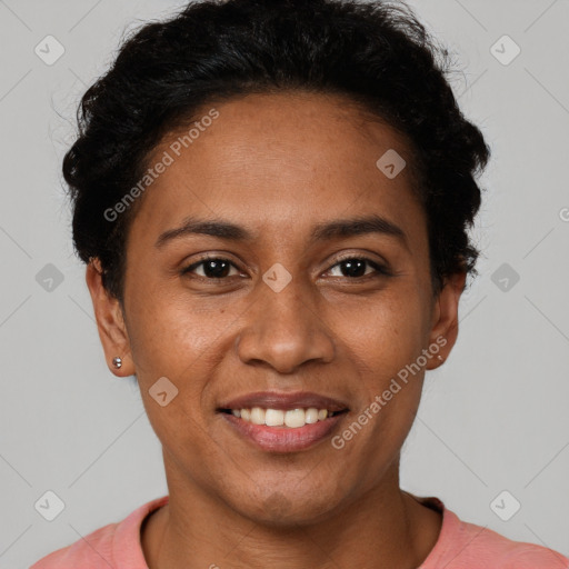 Joyful black young-adult female with short  black hair and brown eyes