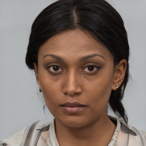 Neutral latino young-adult female with medium  black hair and brown eyes