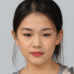 Neutral asian young-adult female with medium  brown hair and brown eyes