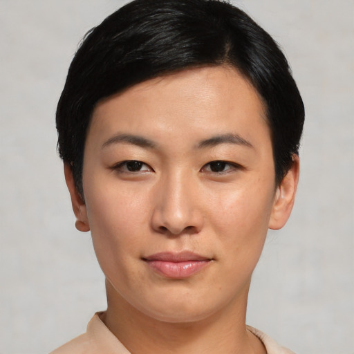 Joyful asian young-adult female with short  black hair and brown eyes