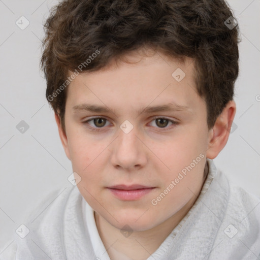 Joyful white child male with short  brown hair and brown eyes