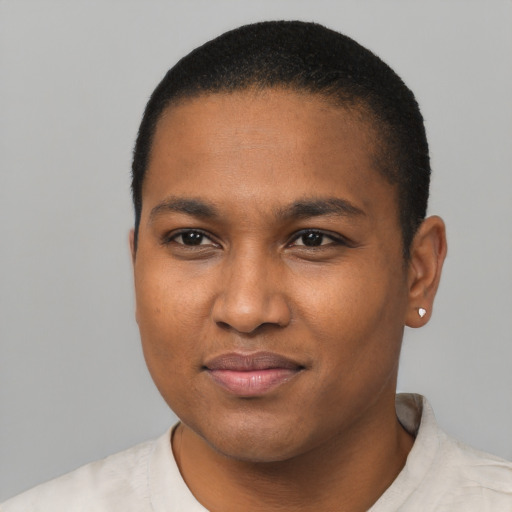 Joyful black young-adult male with short  black hair and brown eyes