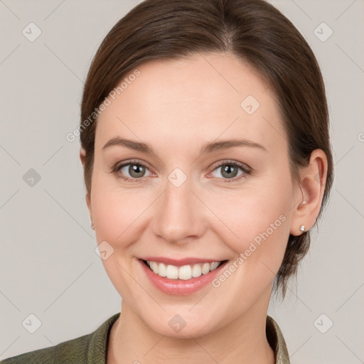 Joyful white young-adult female with medium  brown hair and grey eyes