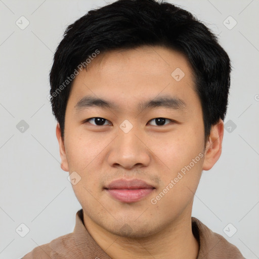 Joyful asian young-adult male with short  black hair and brown eyes