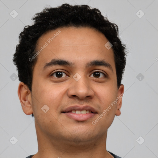 Joyful latino young-adult male with short  brown hair and brown eyes