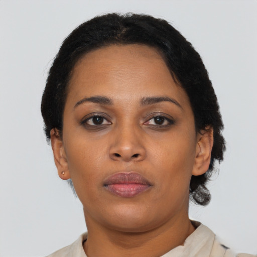 Neutral black young-adult female with short  brown hair and brown eyes