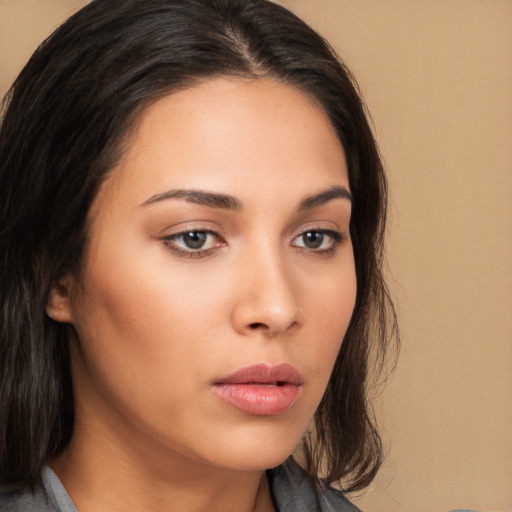 Neutral white young-adult female with medium  brown hair and brown eyes