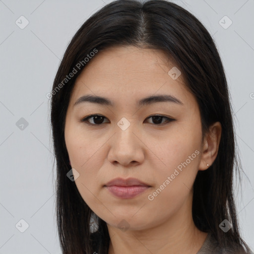 Joyful asian young-adult female with long  brown hair and brown eyes