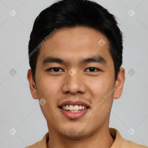 Joyful asian young-adult male with short  black hair and brown eyes