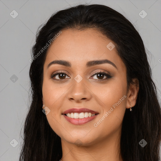 Joyful latino young-adult female with long  black hair and brown eyes