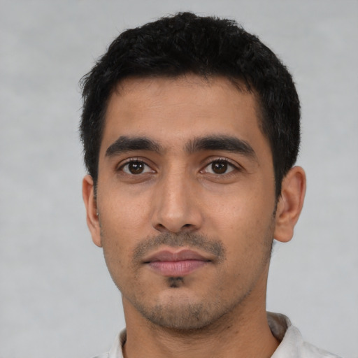Neutral latino young-adult male with short  black hair and brown eyes