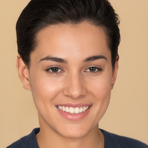 Joyful white young-adult female with short  brown hair and brown eyes