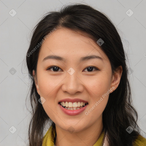 Joyful asian young-adult female with long  brown hair and brown eyes