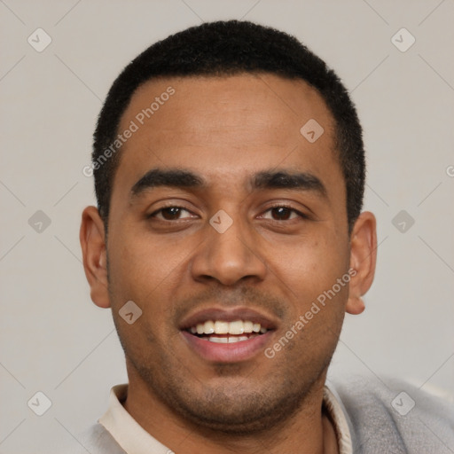 Joyful black young-adult male with short  black hair and brown eyes
