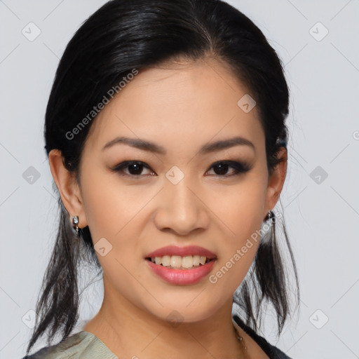 Joyful asian young-adult female with medium  black hair and brown eyes