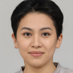 Joyful asian young-adult female with short  brown hair and brown eyes