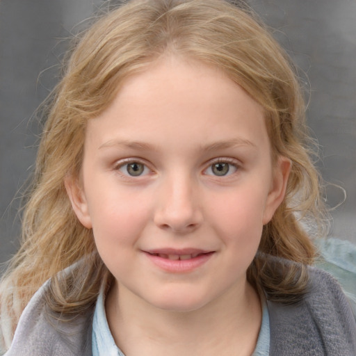 Joyful white child female with medium  brown hair and blue eyes