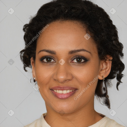 Joyful black young-adult female with medium  brown hair and brown eyes