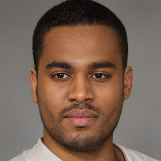 Neutral latino young-adult male with short  brown hair and brown eyes