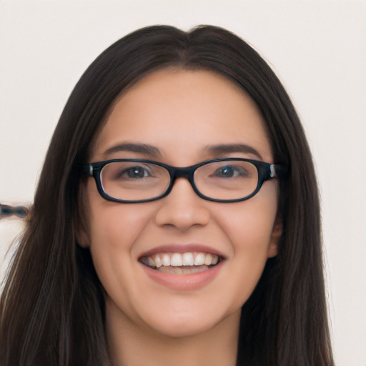 Joyful white young-adult female with long  black hair and brown eyes