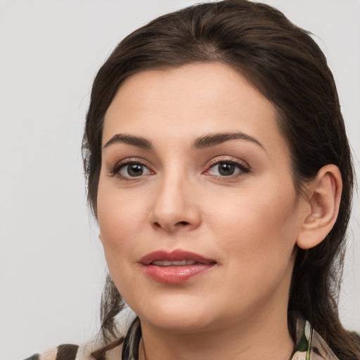 Joyful white young-adult female with medium  brown hair and brown eyes