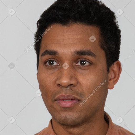 Neutral latino young-adult male with short  black hair and brown eyes