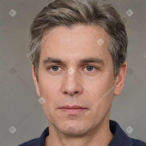 Neutral white adult male with short  brown hair and grey eyes