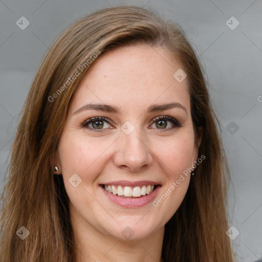 Joyful white young-adult female with long  brown hair and green eyes