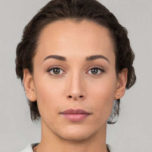 Neutral white young-adult female with short  brown hair and brown eyes