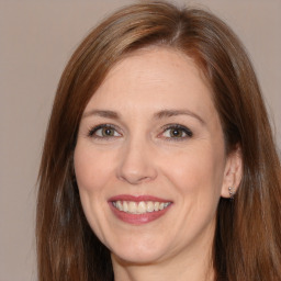 Joyful white adult female with medium  brown hair and brown eyes