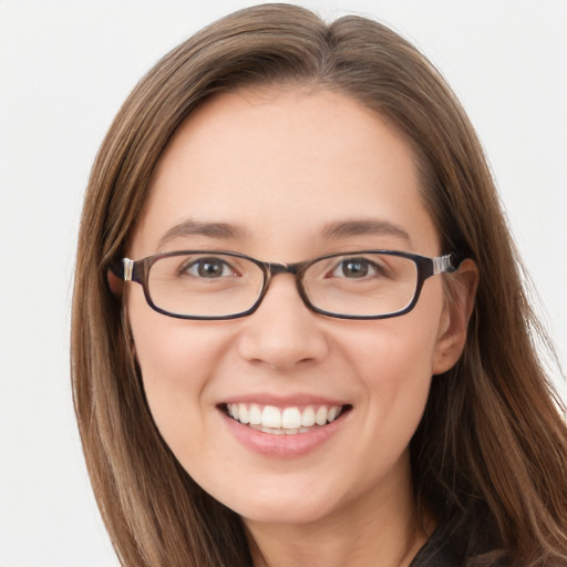 Joyful white young-adult female with long  brown hair and blue eyes