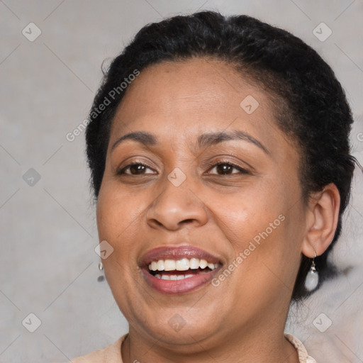 Joyful latino adult female with short  brown hair and brown eyes