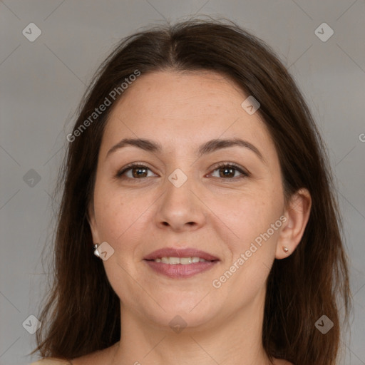 Joyful white adult female with medium  brown hair and brown eyes